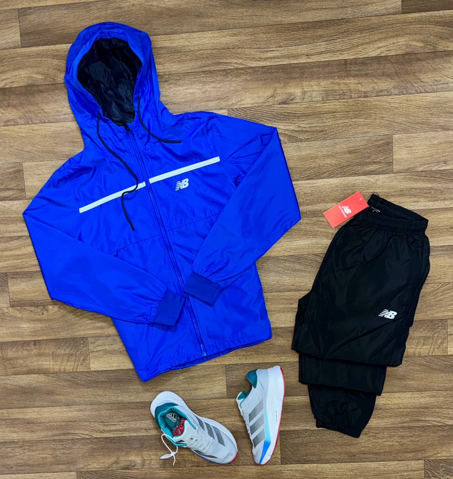 Survêtement Imperméable New Balance – Confort et Performance