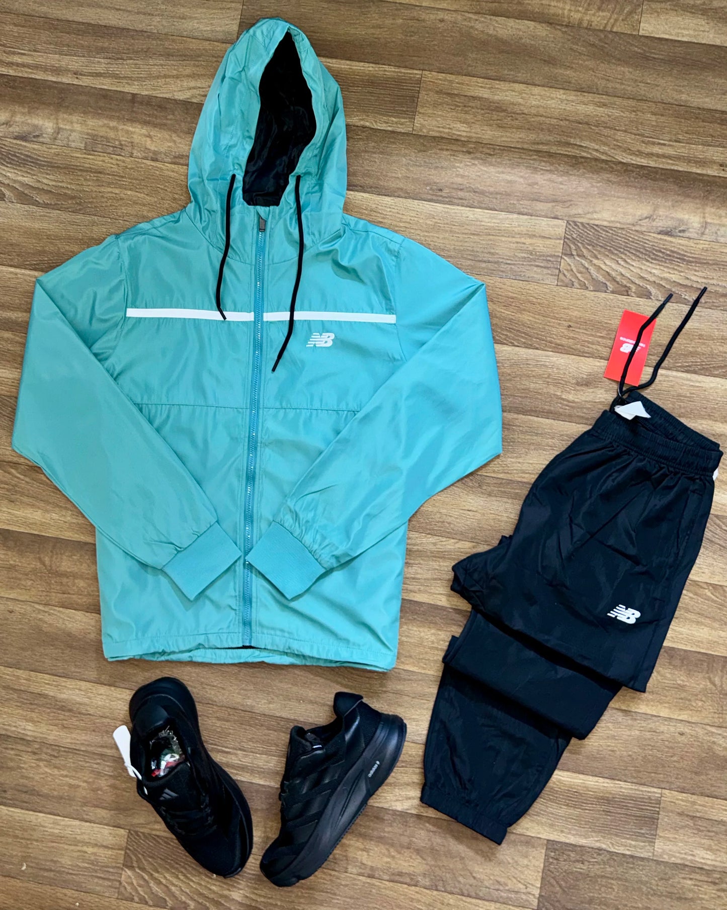 Survêtement Imperméable New Balance – Confort et Performance